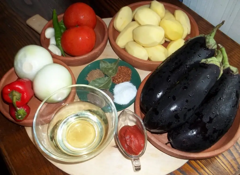 roast beef with potatoes in a cauldron