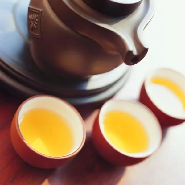 Te Guan Yin oolong-tee: vaikutus, ruoanlaittomenetelmät, juomakulttuuri