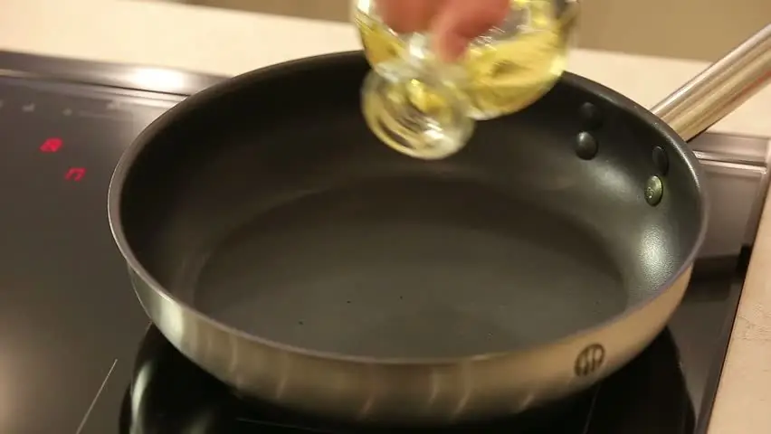 Pour oil into the pan