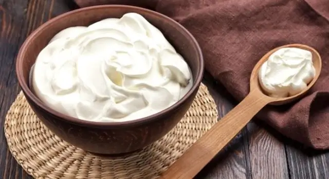 Sour cream with a spoon