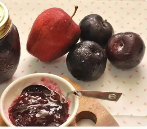 We cook together delicious and fragrant jam from plums and apples